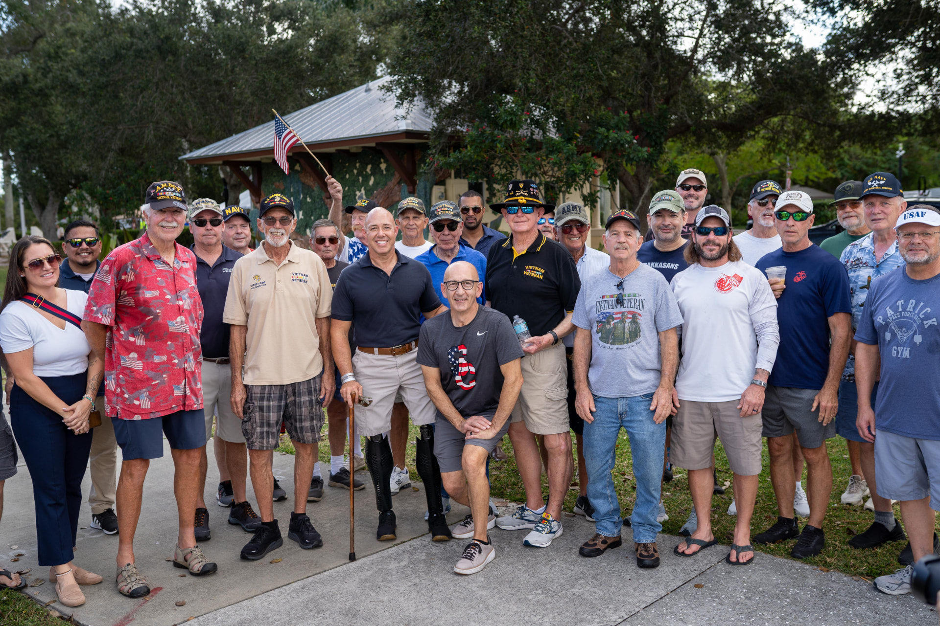 WE-HAUL team standing with American veterans at a community event